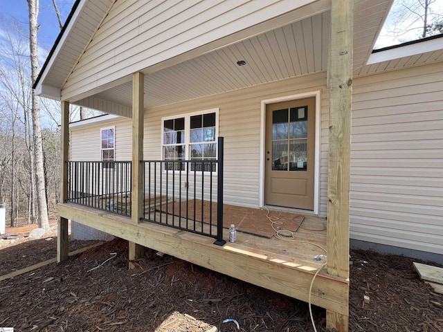 property entrance with covered porch