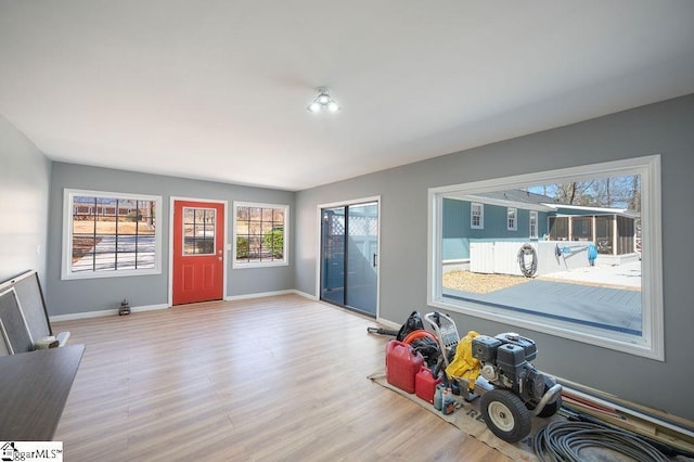 entryway featuring wood finished floors and baseboards