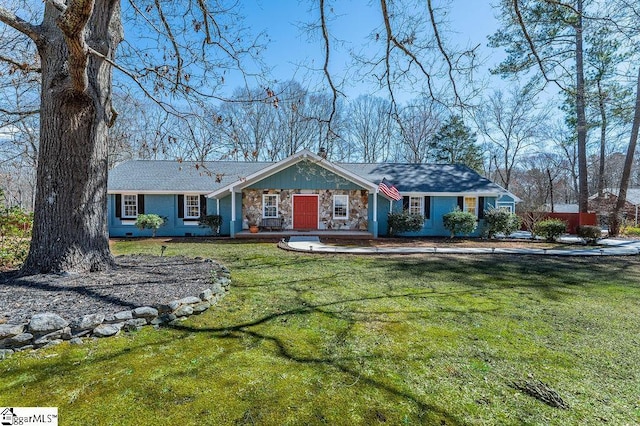 view of front of home featuring stone siding and a front lawn