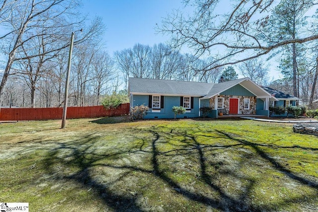 view of front of home featuring stone siding, fence, a chimney, and a front lawn