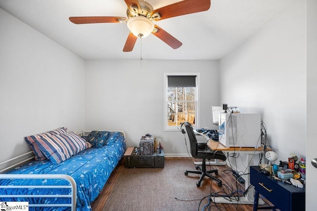 office featuring ceiling fan and baseboards