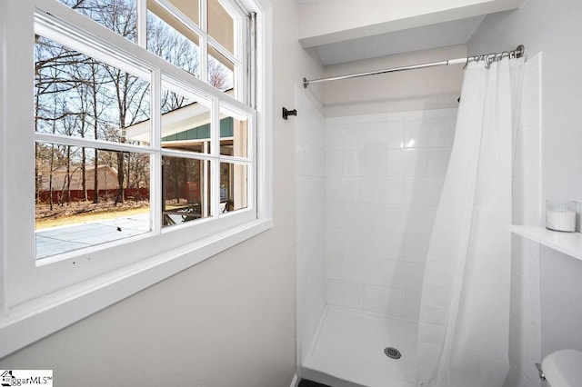 full bathroom with tiled shower