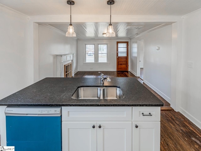 kitchen with dark wood-style floors, white cabinets, a sink, and dishwashing machine