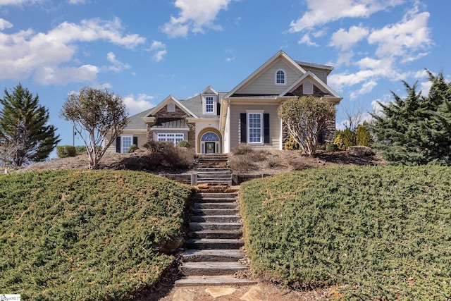 view of front of property with stairs