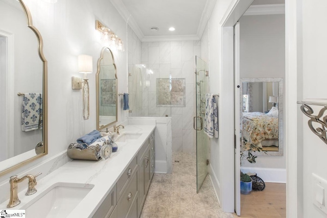 bathroom with ensuite bath, a stall shower, crown molding, and a sink