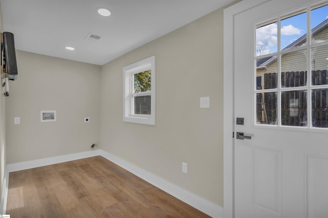 washroom with hookup for a washing machine, laundry area, visible vents, baseboards, and electric dryer hookup