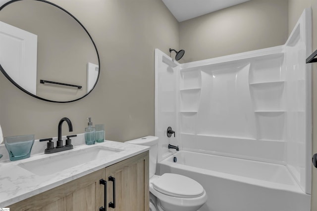 bathroom featuring tub / shower combination, vanity, and toilet