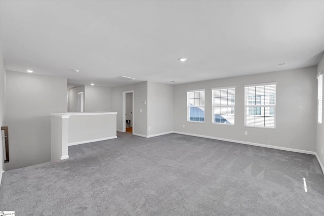 carpeted empty room with recessed lighting and baseboards