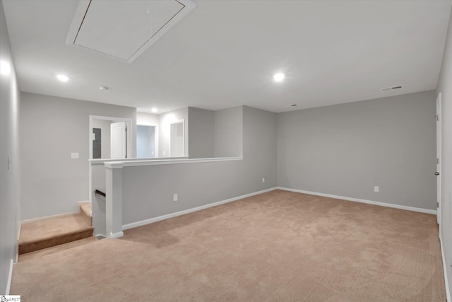 basement with recessed lighting, light carpet, visible vents, and baseboards