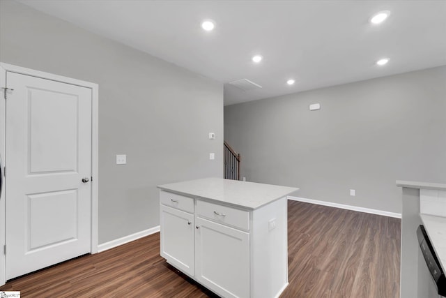 kitchen with baseboards, dark wood-type flooring, light countertops, white cabinetry, and recessed lighting