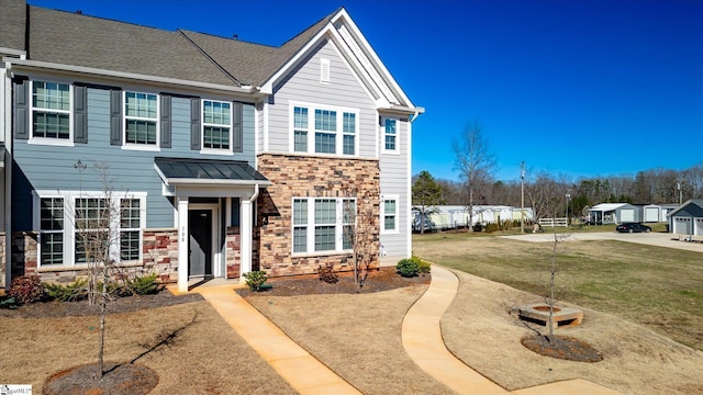 108 Gaskins Trl, Travelers Rest, SC 29690 - view of front facade featuring metal roof, stone siding, a standing seam roof, and a front yard