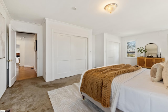 carpeted bedroom with crown molding