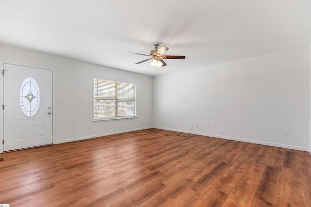 entrance foyer with ceiling fan, baseboards, and wood finished floors