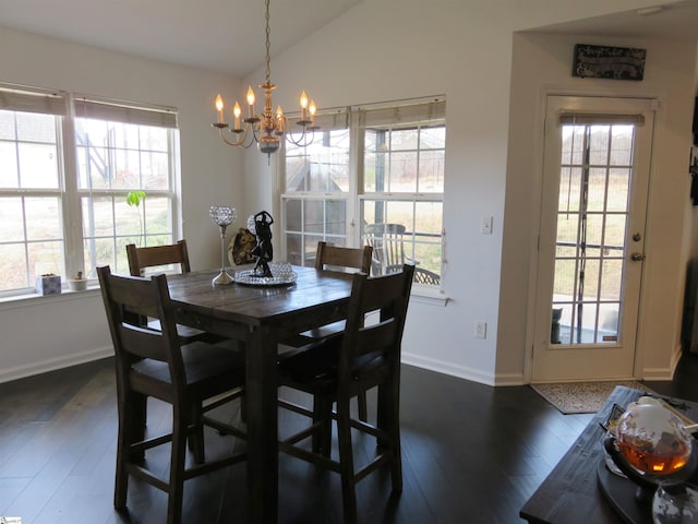 dining room with lofted ceiling, a notable chandelier, baseboards, and dark wood-type flooring