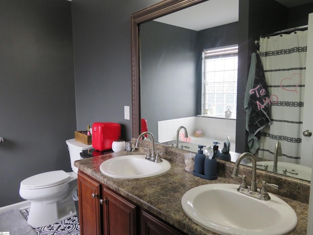 full bathroom with toilet, double vanity, a sink, and a shower with shower curtain