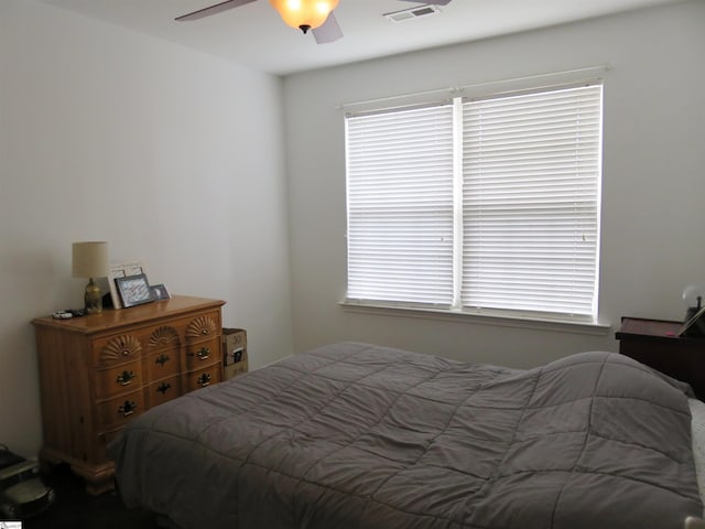 bedroom featuring ceiling fan and visible vents