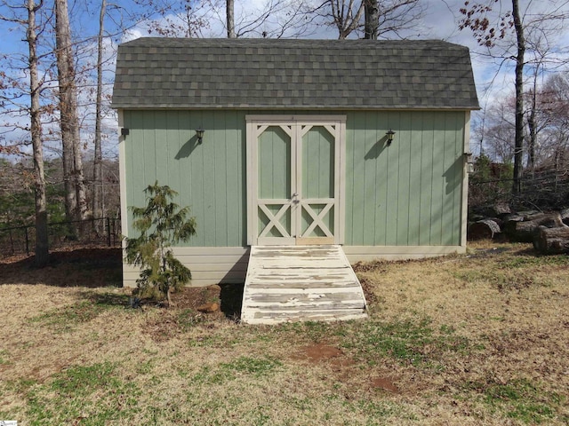 view of shed with fence