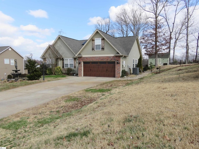 traditional home featuring brick siding, central AC, a garage, driveway, and a front lawn