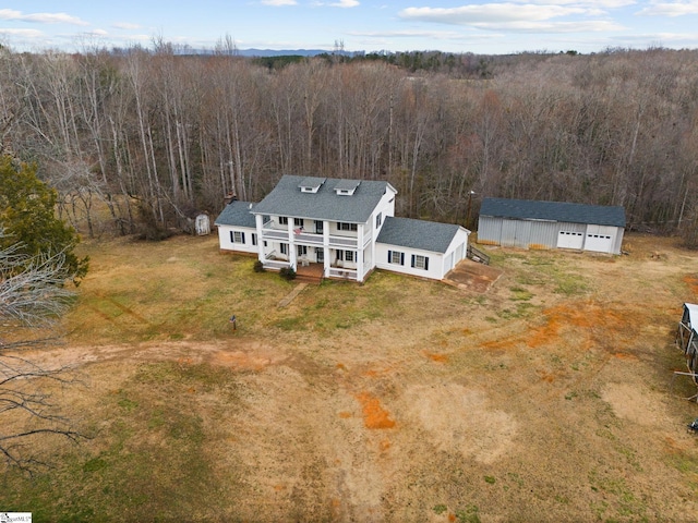 bird's eye view featuring a forest view