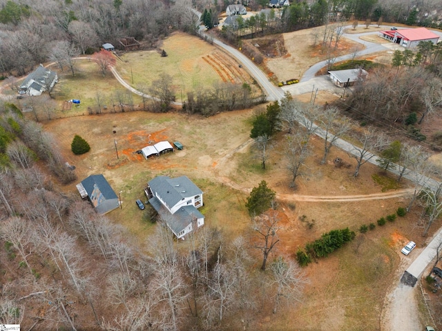 birds eye view of property with a rural view