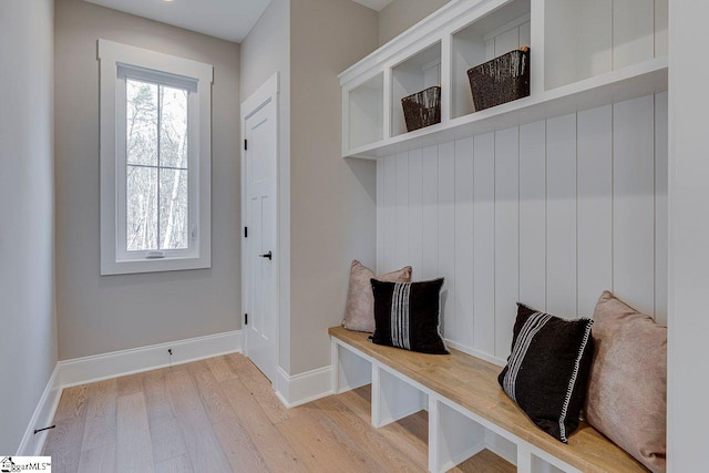 mudroom with baseboards and light wood finished floors