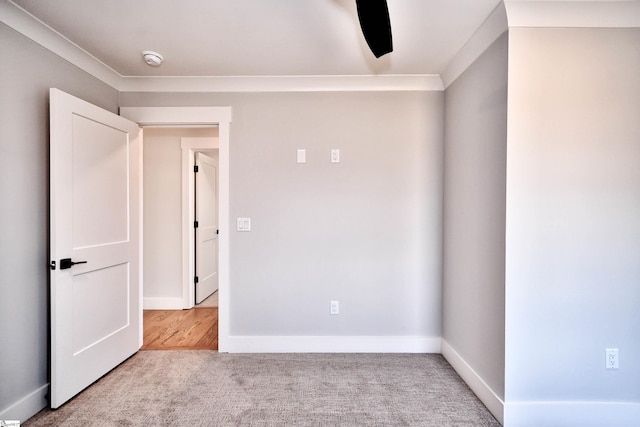 carpeted empty room with baseboards