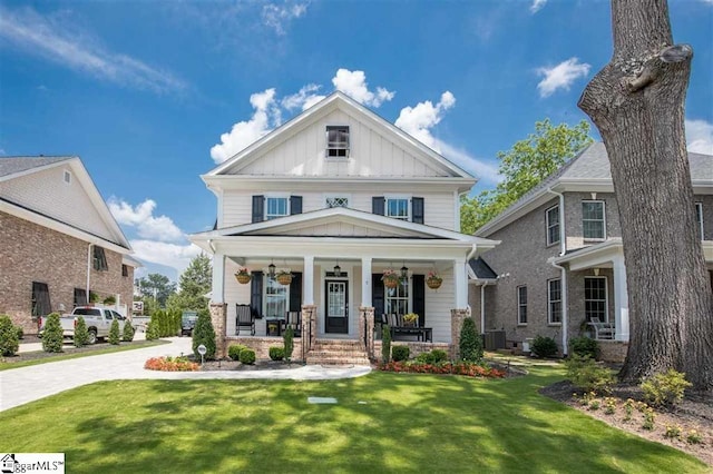 view of front of house featuring central AC unit, covered porch, driveway, board and batten siding, and a front yard