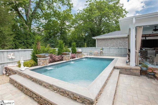 view of pool with a fenced in pool, a fenced backyard, a patio, and a ceiling fan