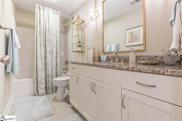 bathroom featuring visible vents, toilet, tile patterned floors, shower / bath combo with shower curtain, and vanity