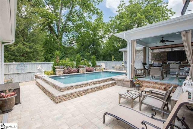 view of swimming pool with ceiling fan, a patio area, a fenced backyard, and a fenced in pool