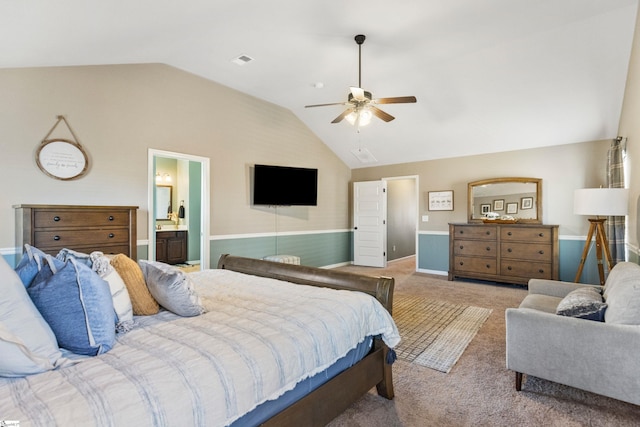 bedroom with visible vents, connected bathroom, a ceiling fan, lofted ceiling, and carpet floors