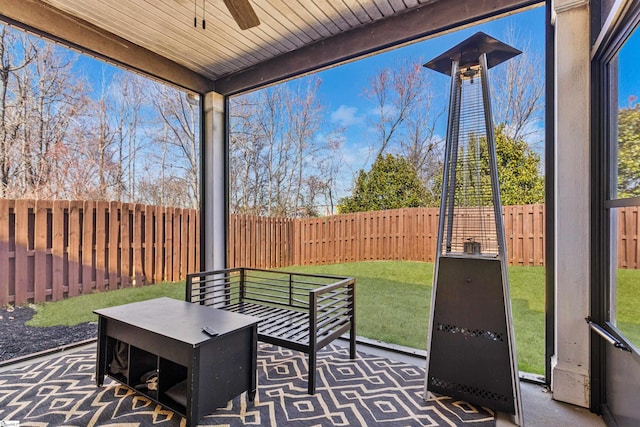 sunroom / solarium featuring ceiling fan and a wealth of natural light