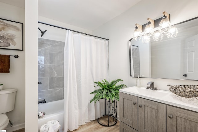 bathroom featuring wood finished floors, vanity, toilet, and shower / tub combo with curtain