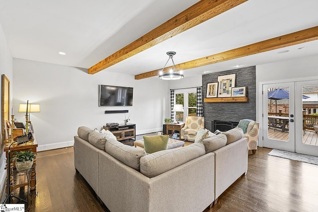 living room with baseboards, dark wood finished floors, beamed ceiling, and french doors