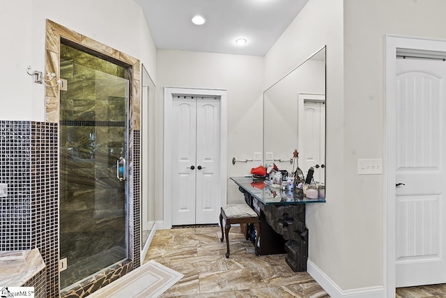 full bathroom featuring a stall shower, baseboards, and recessed lighting