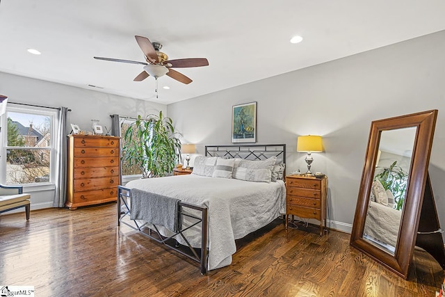 bedroom with recessed lighting, baseboards, and wood finished floors