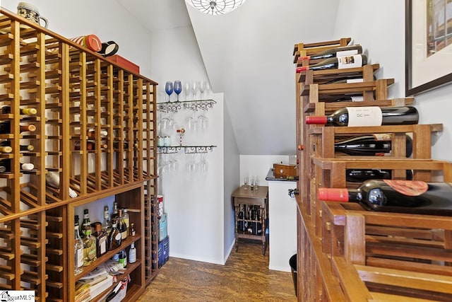 wine room featuring lofted ceiling