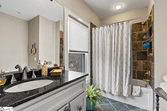 full bathroom featuring vanity and shower / bath combo with shower curtain