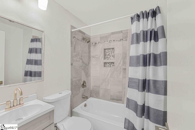 bathroom featuring shower / tub combo, vanity, and toilet