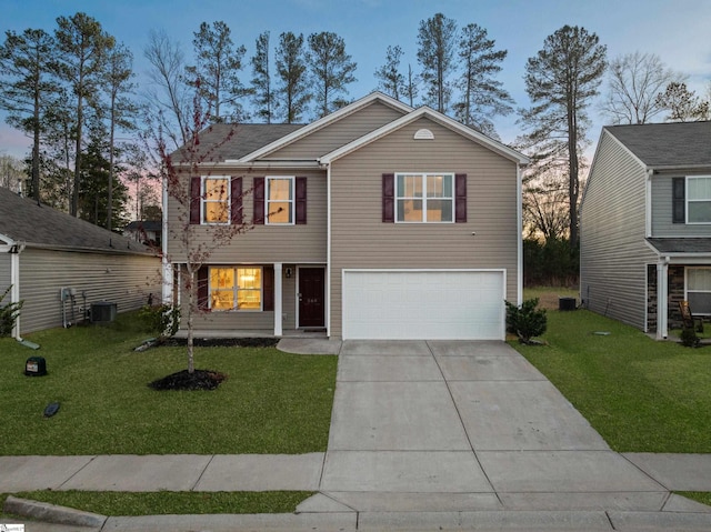 traditional home featuring a garage, concrete driveway, central AC, and a lawn