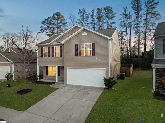 view of front facade featuring a garage, driveway, a yard, and cooling unit