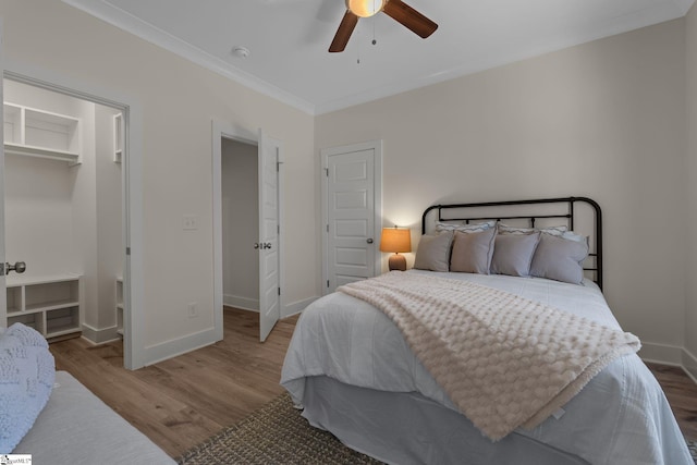 14 Arden Street Units A & B, Greenville, SC 29607 - bedroom with wood finished floors, a ceiling fan, baseboards, ornamental molding, and a walk in closet