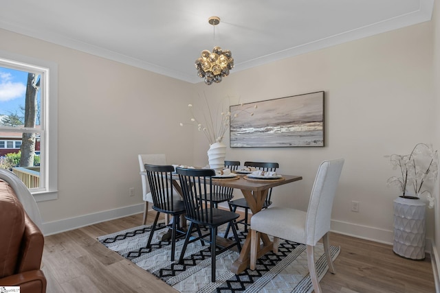 14 Arden Street Units A & B, Greenville, SC 29607 - dining area featuring a notable chandelier, crown molding, baseboards, and wood finished floors