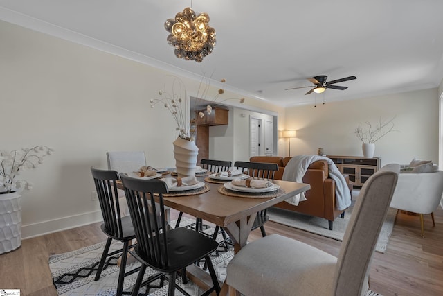 14 Arden Street Units A & B, Greenville, SC 29607 - dining room featuring baseboards, light wood finished floors, ceiling fan with notable chandelier, and crown molding