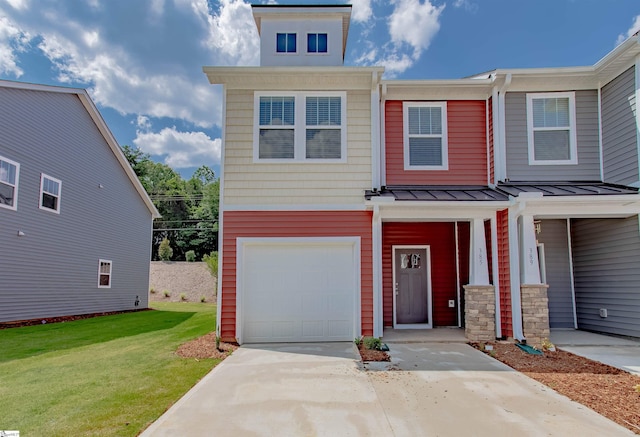 view of front of house with metal roof, a garage, driveway, a standing seam roof, and a front yard