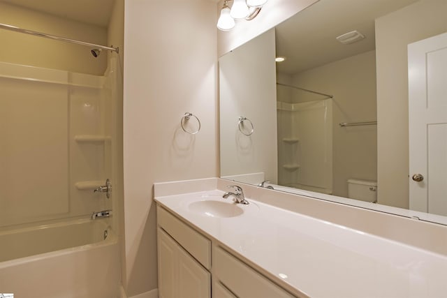 full bathroom with visible vents, shower / washtub combination, vanity, and toilet