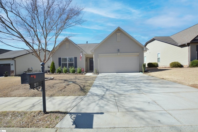 ranch-style house featuring concrete driveway and an attached garage