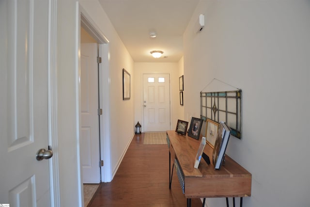 entryway with baseboards and dark wood finished floors