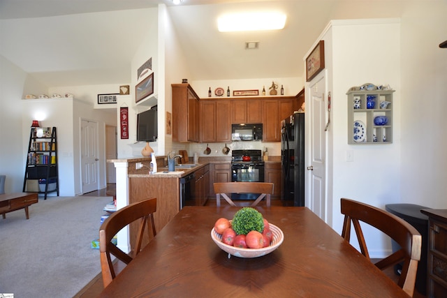 dining space featuring carpet