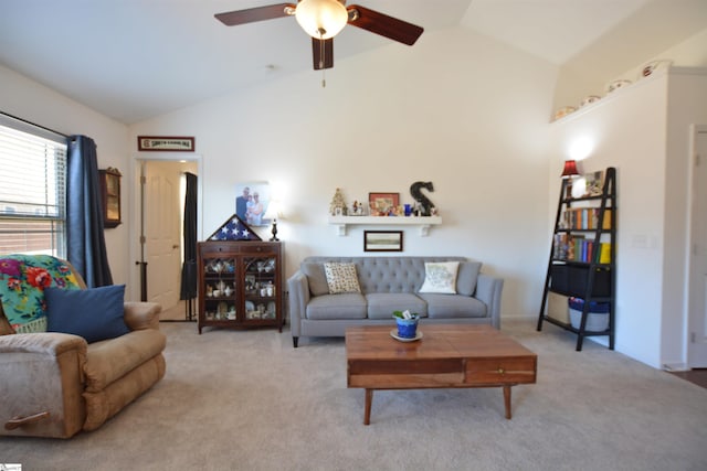 living area with high vaulted ceiling, carpet, and a ceiling fan